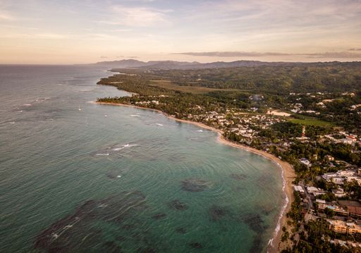 A beautiful high angle shot of a resort town on a seashore and a sea