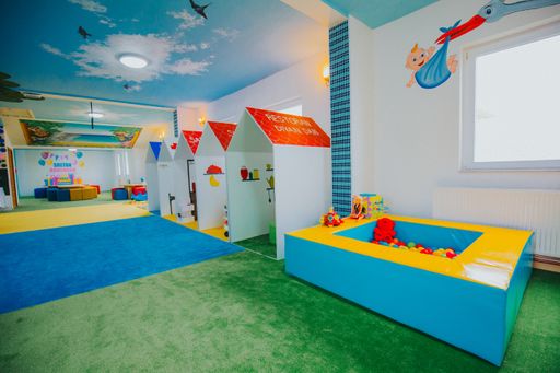 A wide shot of boys and girls playground area at a daycare center