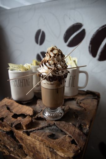 A selective focus shot of coffee beverage on a wooden table