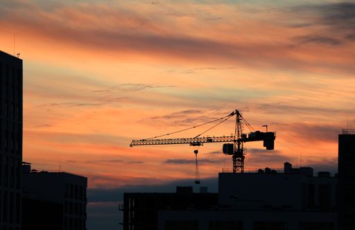 A beautiful shot of a silhouette of a crane during the sunset