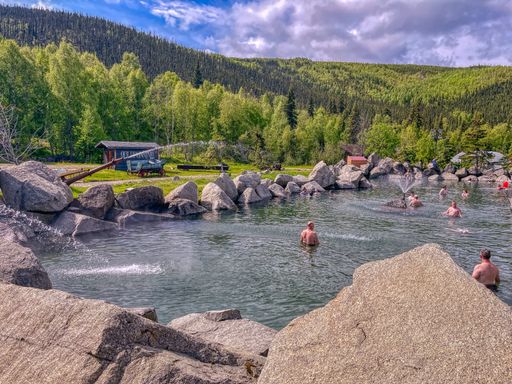The view of people relaxing in the Chena Hot Springs in Alaska, USA