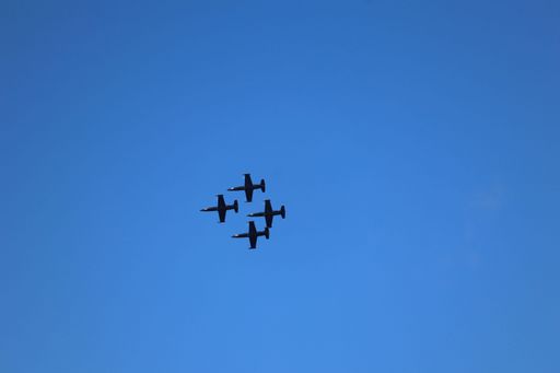 Four jets in diamond formation fly over San Francisco Bay during Fleet Week