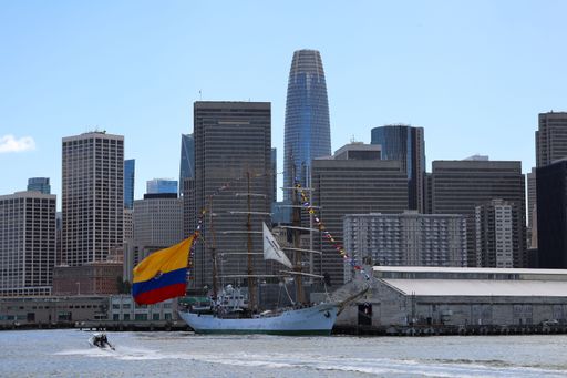 ARC Gloria ship docked in San Francisco Bay with city skyline in the background