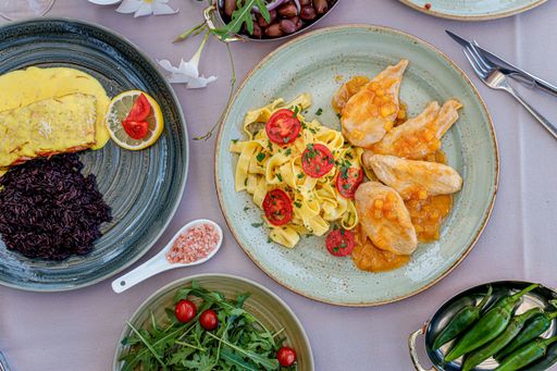 A top view of assorted food set on a table in the restaurant