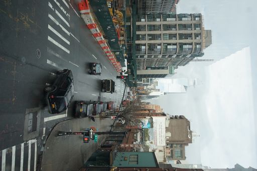 A vertical shot of a busy street in New York City, United States