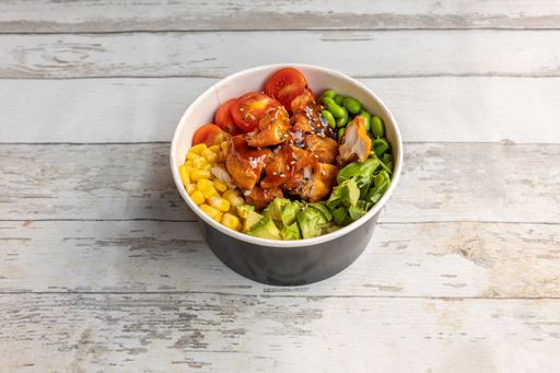 A closeup shot of Asian meal in the bowl on the wooden table