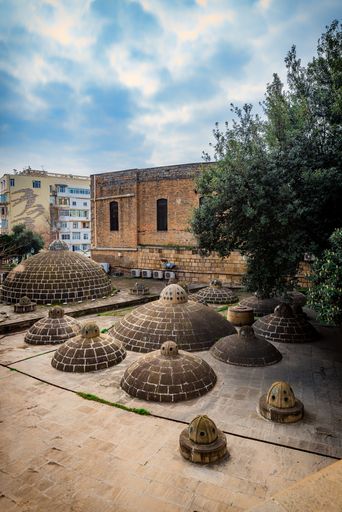 A beautiful view of the Ancient Khans Baths near the Maidens Tower with a cloudy sky in Baku, Azerbaijan