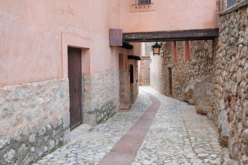 A vertical shot of an old lane during the day in Albarracin, Spain