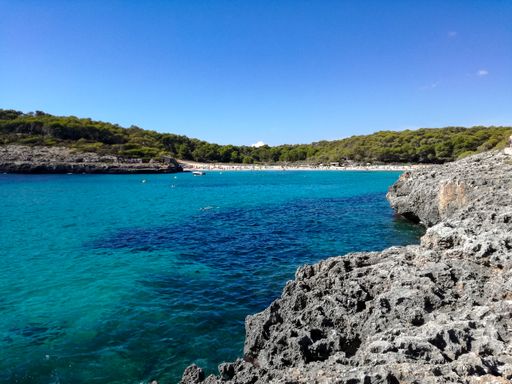 A beautiful view of the beach of Mondrago Natural Park in Spain during the daytime