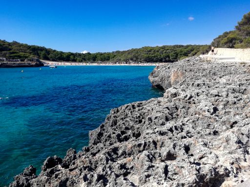 A beautiful view of the beach of Mondrago Natural Park in Spain during the daytime