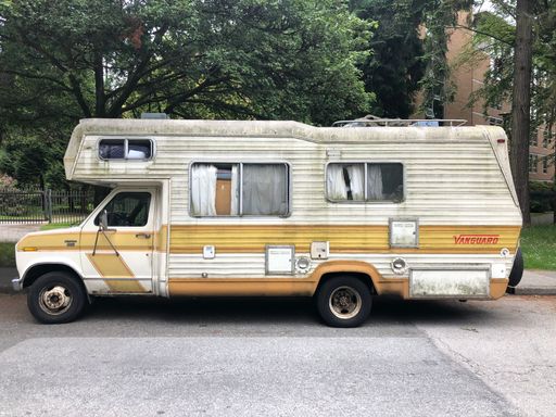 An old and rusty camper van  for traveling in the street
