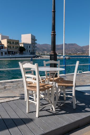 A vertical shot of the cozy outdoor cafe on the dock