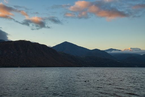 The Lake Orta and natural landscapes viewed from the San Giulio Island in Piedmont, Italy at sunset