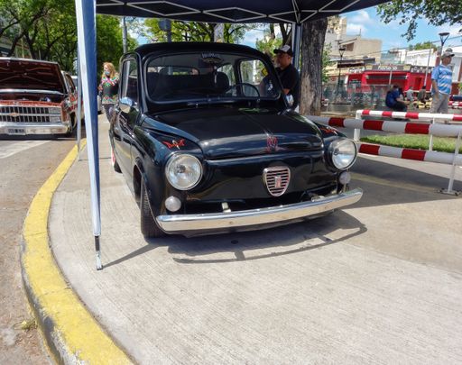 black Fiat 600 sedan two door rear engined unibody built in Argentina circa 1970. Front view. Expo Warnes 2021 classic car show. Copyspace