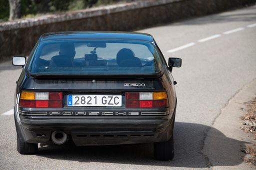 A man driving Porsche 924 VIII Rallye on a highway in Catalonia, Spain