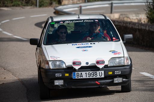 A man driving Ford Fiesta Mk3 VIII Rallye on a highway in Catalonia, Spain