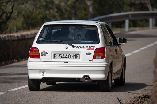 A man driving Ford Fiesta XR2 VIII Rallye on a highway in Catalonia, Spain