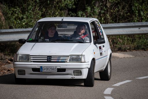 A man driving Peugeot 205 Rallye VIII on a highway in Catalonia, Spain
