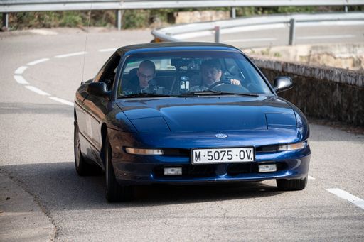 A man driving Ford Probe VIII Rallye on a highway in Catalonia, Spain