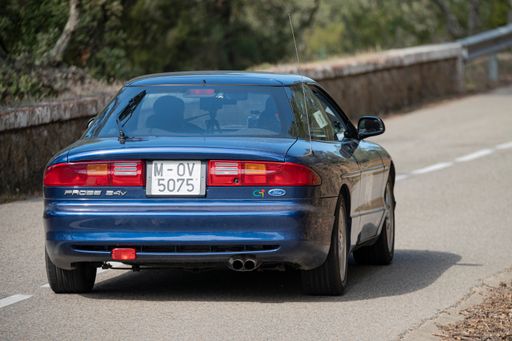 A man driving Ford Probe VIII Rallye on a highway in Catalonia, Spain