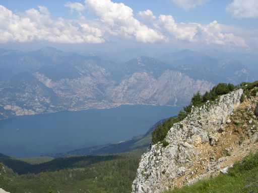 A beautiful view of a lake in the mountains on a gloomy day in Italy