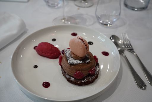 A closeup shot of an exquisite dessert on a white plate