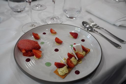 A closeup shot of an exquisite dessert on a white plate