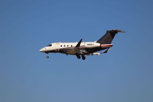 FlexJet Embraer Praetor 500 landing at San Jose Airport, arriving from San Francisco.