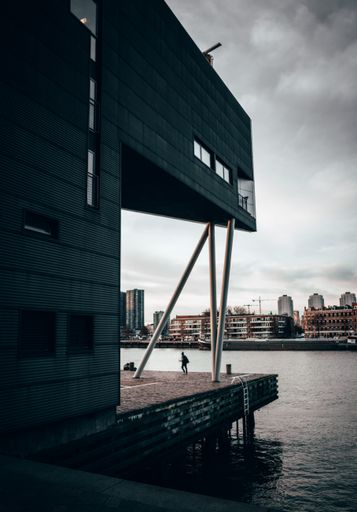 A beautiful view of the waterfront in the city under the cloudy sky