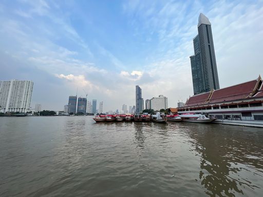 A beautiful shot of the city of Bangkok, Chao Phraya with blue sky under the cloudy skies