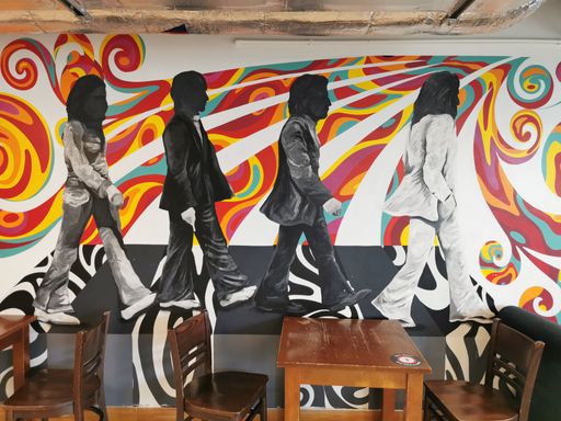 A beautiful painting of The Beatles on a cafe wall, Liverpool, United Kingdom