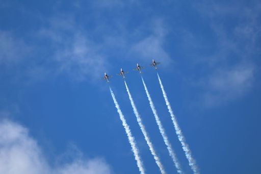 Canadian Snowbirds perform a steep climb with smoke trails at San Francisco Fleet Week.