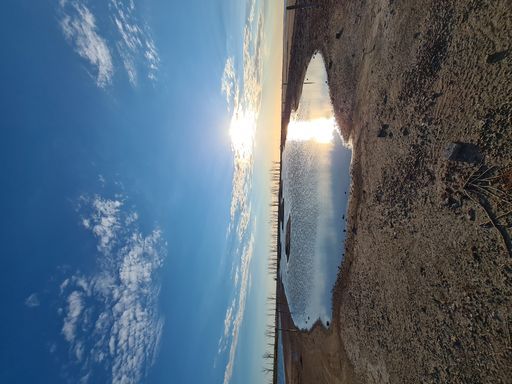 A flipped vertical shot of a puddle at sunset in Epecuen village of Buenos Aires, Argentina