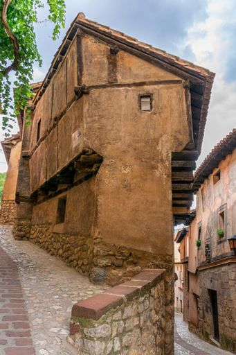 А vertical shot of an alley in the medieval town of Albarracin in the province of Teruel in Aragon, Spain