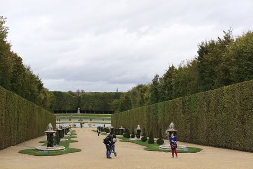 A beautiful view of garden of the Palace of Versailles on a cloudy day in Paris, France