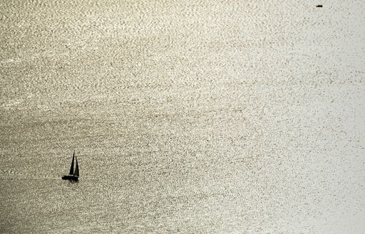 An aerial view of a sailboat on the Ob River in Novosibirsk, Russia