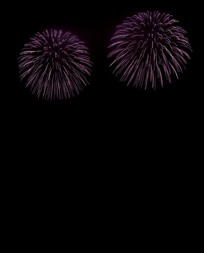 Happy New Year concept. Fireworks that create abstract patterns on night sky. Black background with colorful lightning effects. Long exposure.