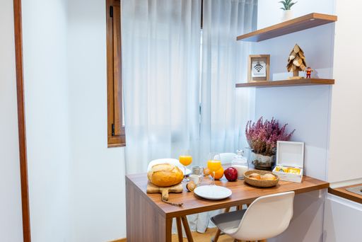 A view of a dinner table in a cozy living room