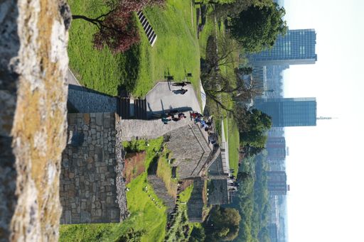An aerial view of a beautiful medieval building by a lake