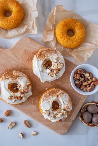 The carrot cake donuts with nuts and eggs for Easter
