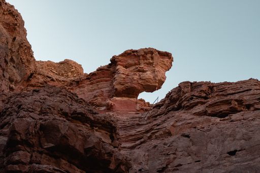 A low angle shot of the beautiful rocky cliffs on the desert captured on a sunny day