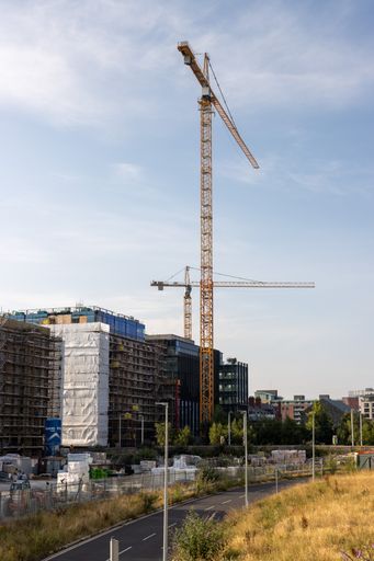 A vertical shot of new apartments and offices under construction in Dublin docklands district
