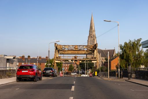A vertical shot of  streets in Dublin and St. Martin's Cathedral on a background