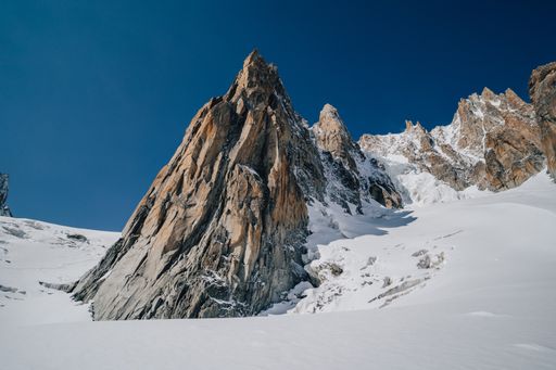 Alpine peaks, Aiguille du Midi and other famous alpine mountains. Alpinism, climbing, glaciers and snow.