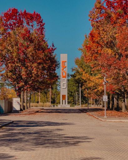 A vertical shot of the park in Clemson University International Center of Automotive Research in fall