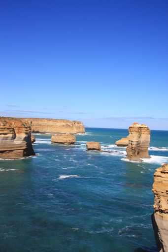 A vertical shot of cliffs  in Loch Ard Gorge Port, Australia on a sunny day