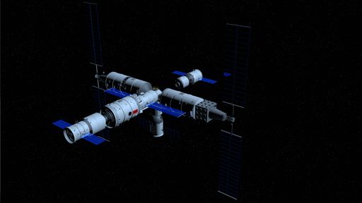 Shenzhou manned space vessel in the direction of coupling to the TIANHE core module in TIANGONG 3 - Chinese space station on black space background