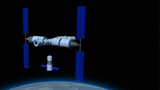 Shenzhou manned space vessel in the direction of coupling to the TIANHE core module in TIANGONG 3 - Chinese space station with the planet Earth below