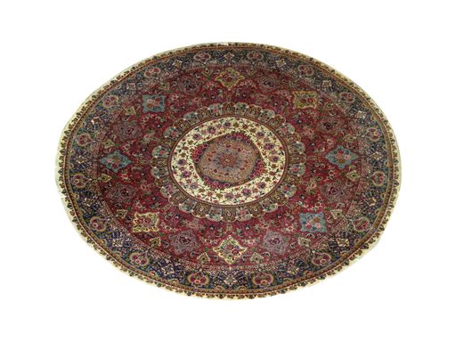 A closeup of a vintage round carpet with beautiful ornaments isolated on a white background