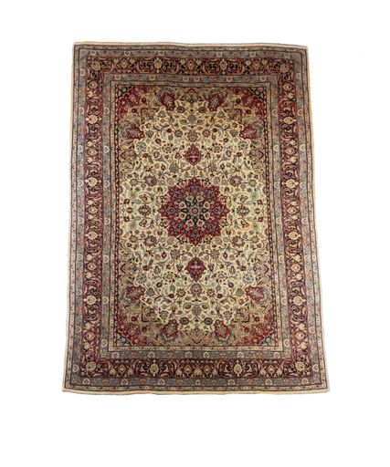 A closeup of a vintage carpet with beautiful ornaments isolated on a white background
